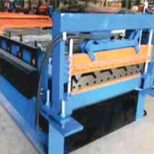 Close-up of blue forming equipment with orange safety guards.