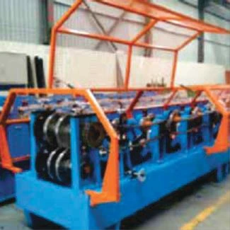 Roll-forming machine with a row of metal forming rollers.
