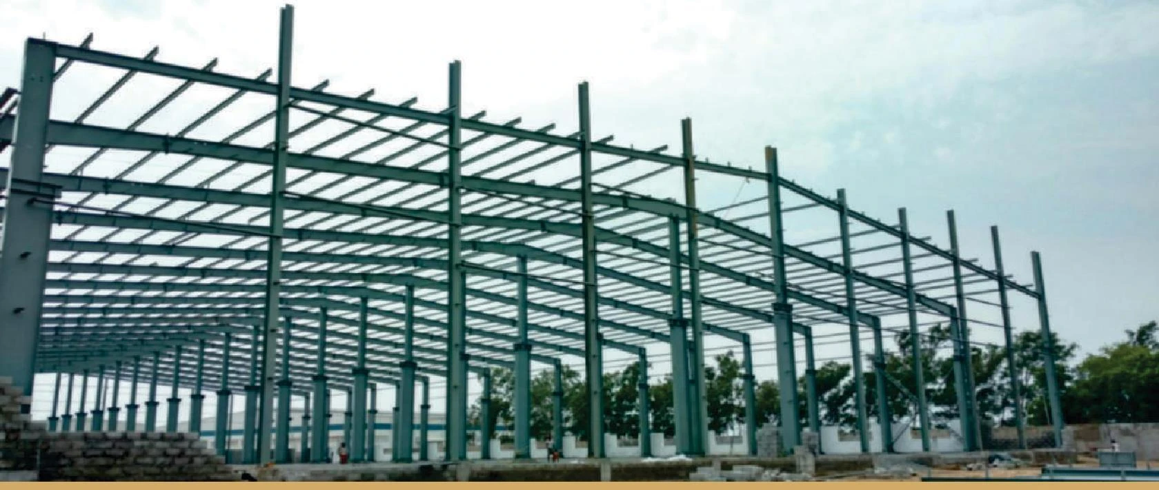 Multi-bay steel frame during construction.